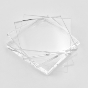 Clear acrylic sheets stacked on top of each other, creating a transparent and orderly arrangement.