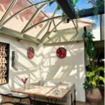 A conservatory with clear roofing.
