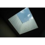 A skylight with blue sky and clouds.