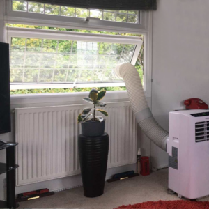 Image of clear acrylic Panel in a window with an air-conditioning unit going out of the window.