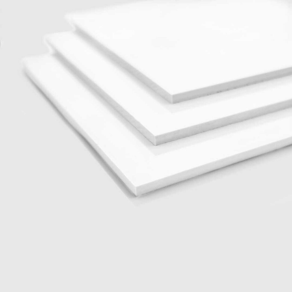 Stacked sheets of white pvc.