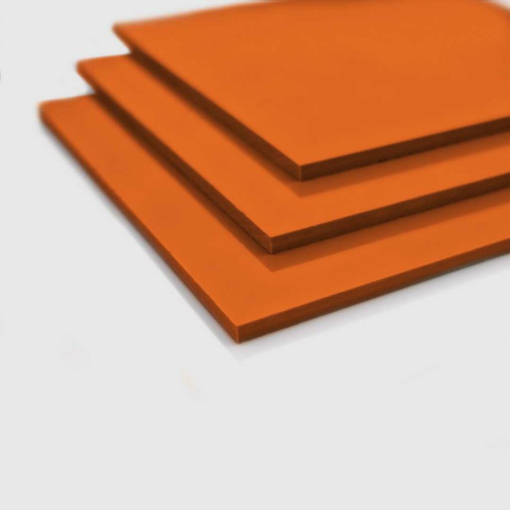 Stacked sheets of orange PVC.