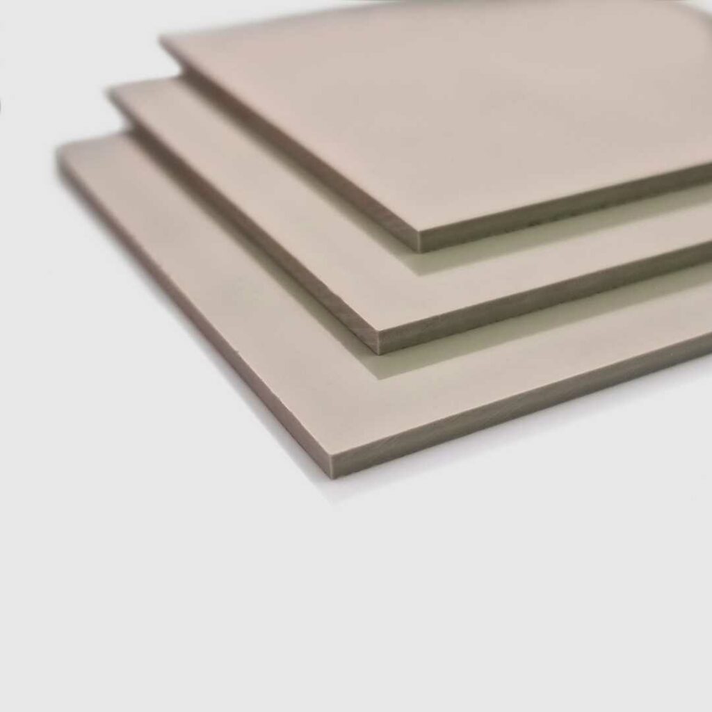 Stacked pastel mushroom coloured pvc sheets.