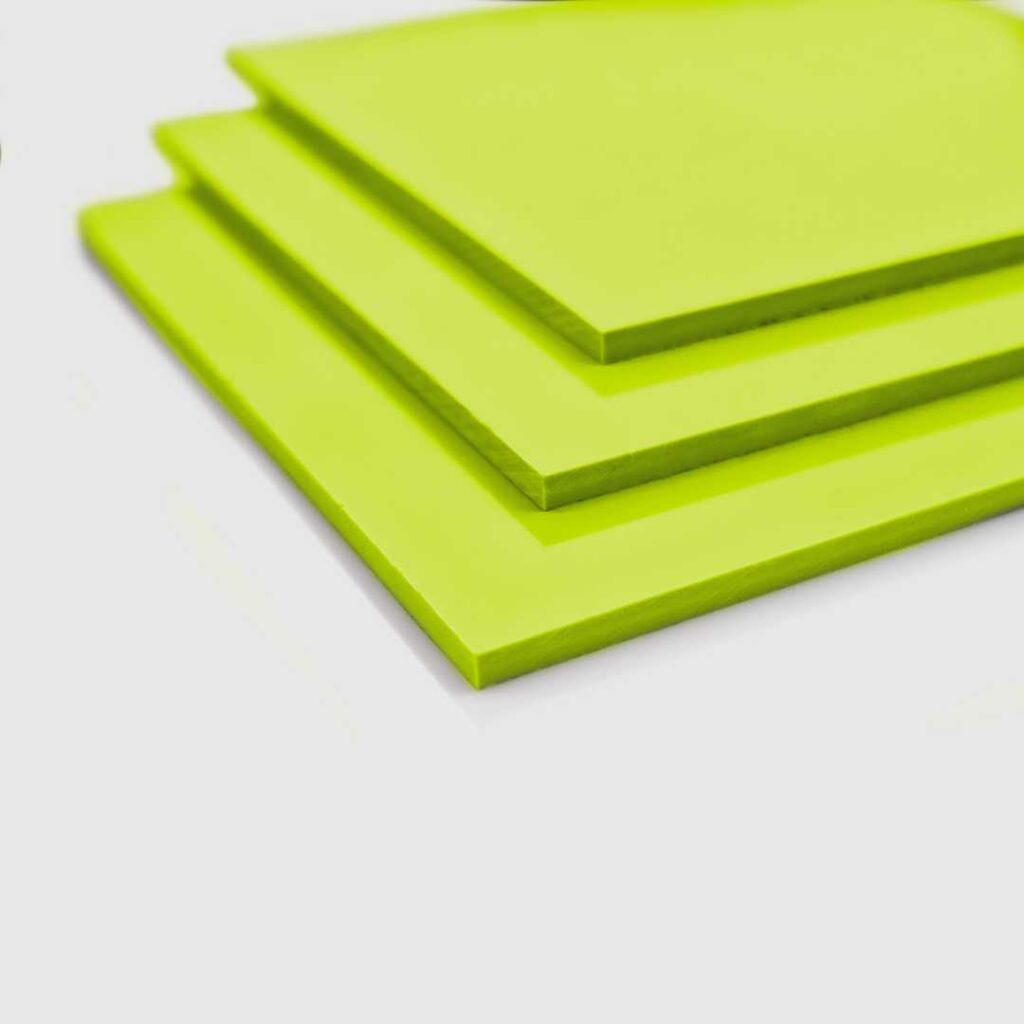 Stacked sheets of lime green pvc.