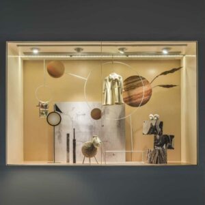 A shop window display with PVC backdrop wall panels.