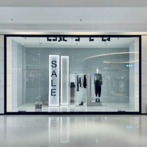 A shop window display with PVC backdrop wall panels.