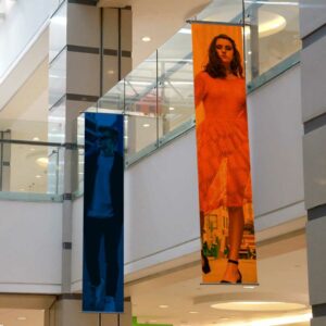 PVC banners hanging in a shopping centre.