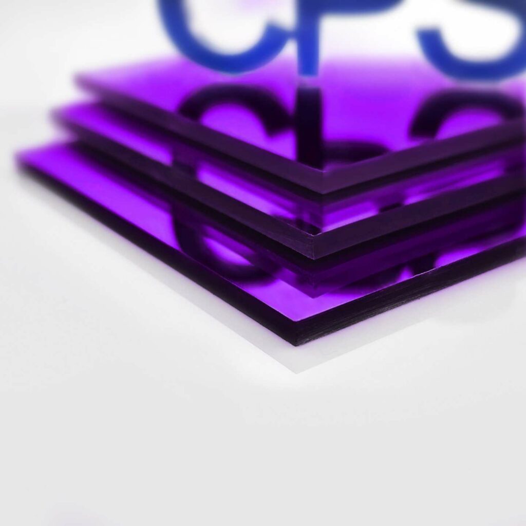 Some purple mirrored sheets stacked on top of one another.