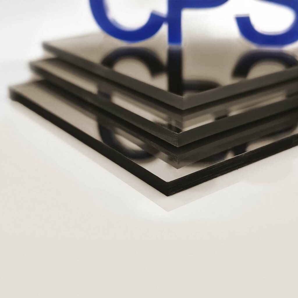 Some light btonze mirrored sheets stacked on top of one another.