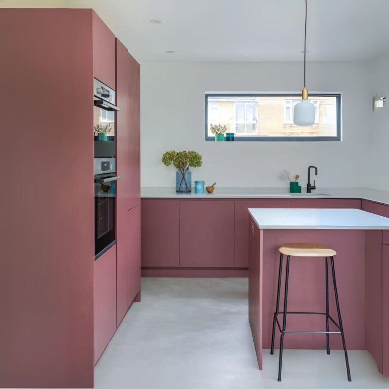 A pink pastel kitchen made from perspex acrylic.