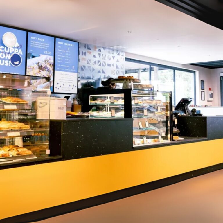 A shop counter front made from yellow perspex acrylic.