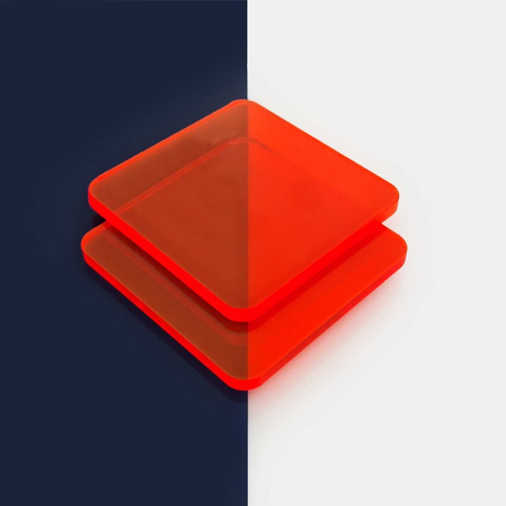 Stacked red fluorescent greencast acrylic perspex sheets.