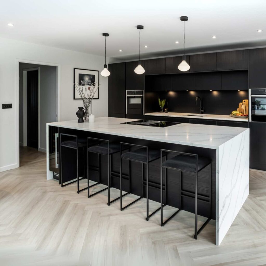 A monochrome kitchen made from gloss perspex acrylic.