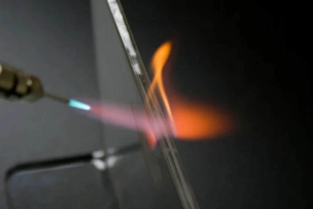 A close up of flame polishing acrylic.